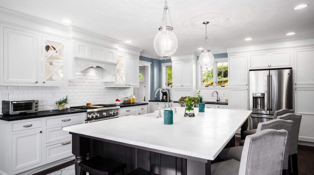 2015 DelCY Award wining kitchen featuring Bishop inset cabinetry and custom glass cabinet doors in Wynnewood, PA.