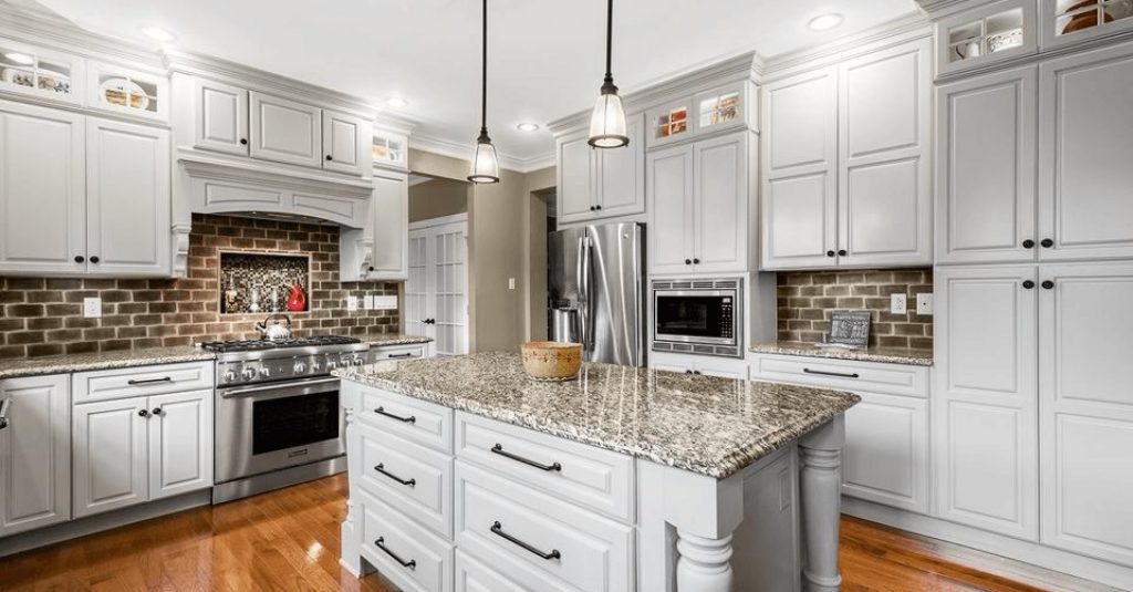 Traditional kitchen designed in white Bishop maple cabinets with Bar Harbor door style.