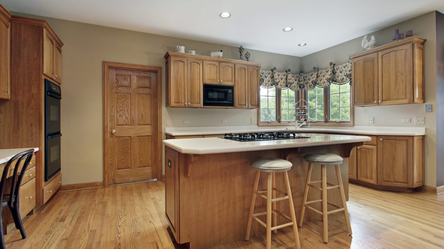 hickory kitchen with arched wall cabinets